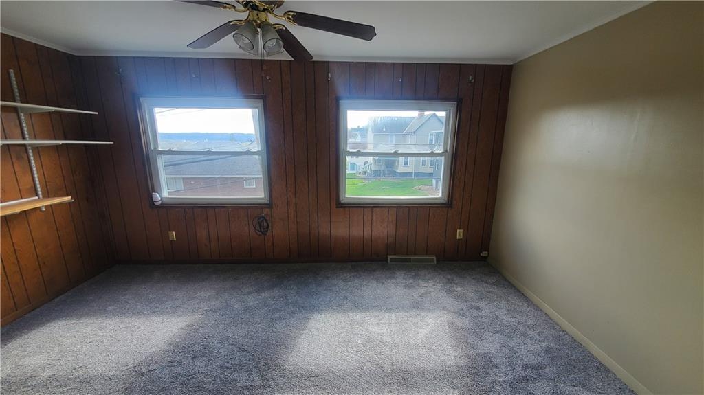 936 Ormond Street Brackenridge, PA 15014 - Photo 17 of 24 an empty room with a window and a fan