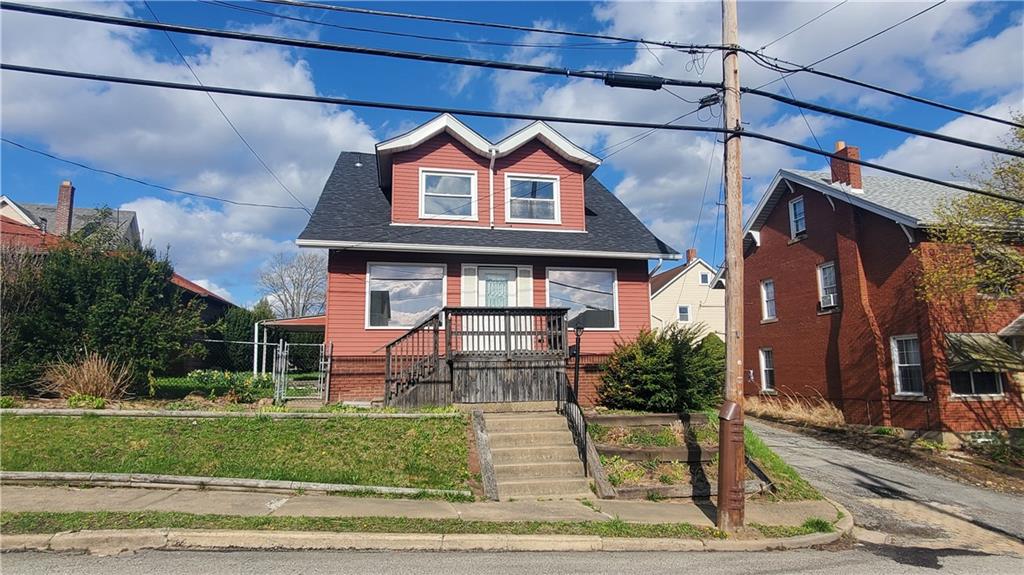 936 Ormond Street Brackenridge, PA 15014 - Photo 3 of 24 a front view of a house with garden