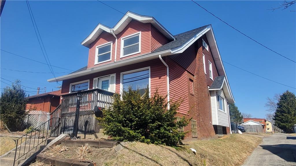 936 Ormond Street Brackenridge, PA 15014 - Photo 4 of 24 a front view of a house with a yard