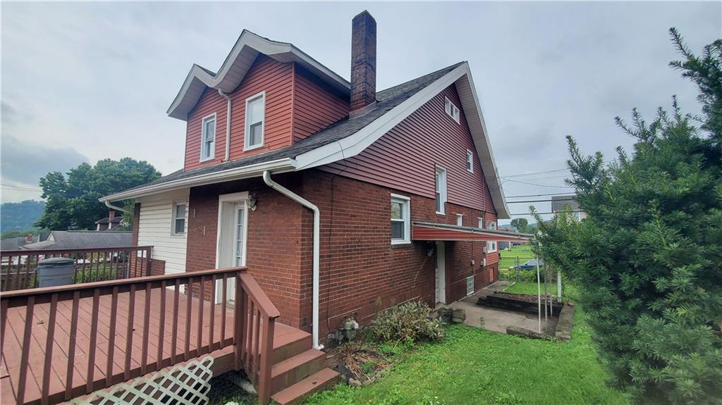936 Ormond Street Brackenridge, PA 15014 - Photo 6 of 24 a view of a house with a yard and deck