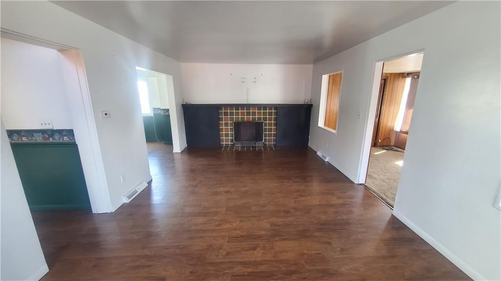 936 Ormond Street Brackenridge, PA 15014 - Photo 9 of 24 a view of an empty room with wooden floor and a window
