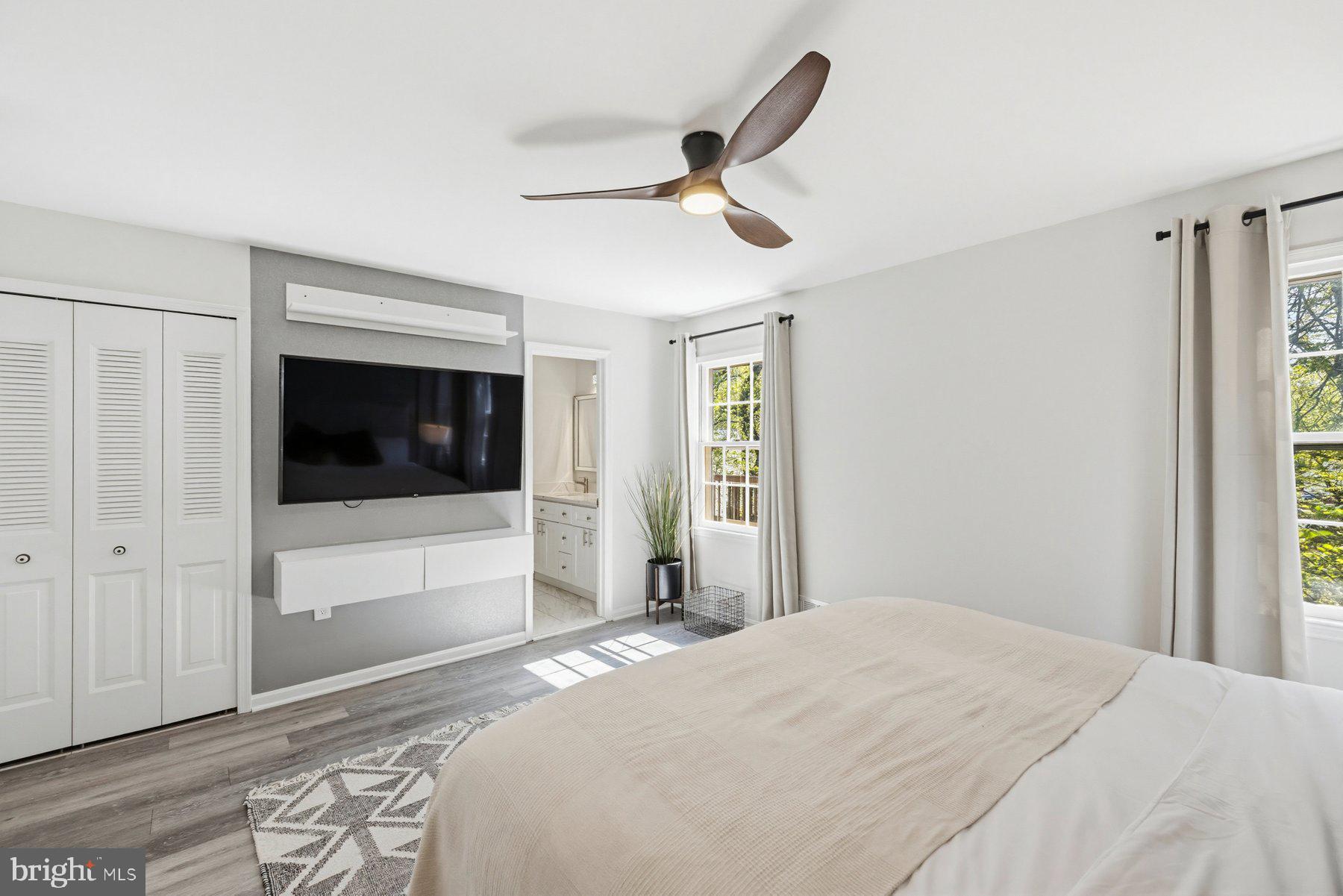 7305 Langsford Court Springfield, VA 22153 - Photo 19 of 46 a bedroom with a bed and a flat screen tv