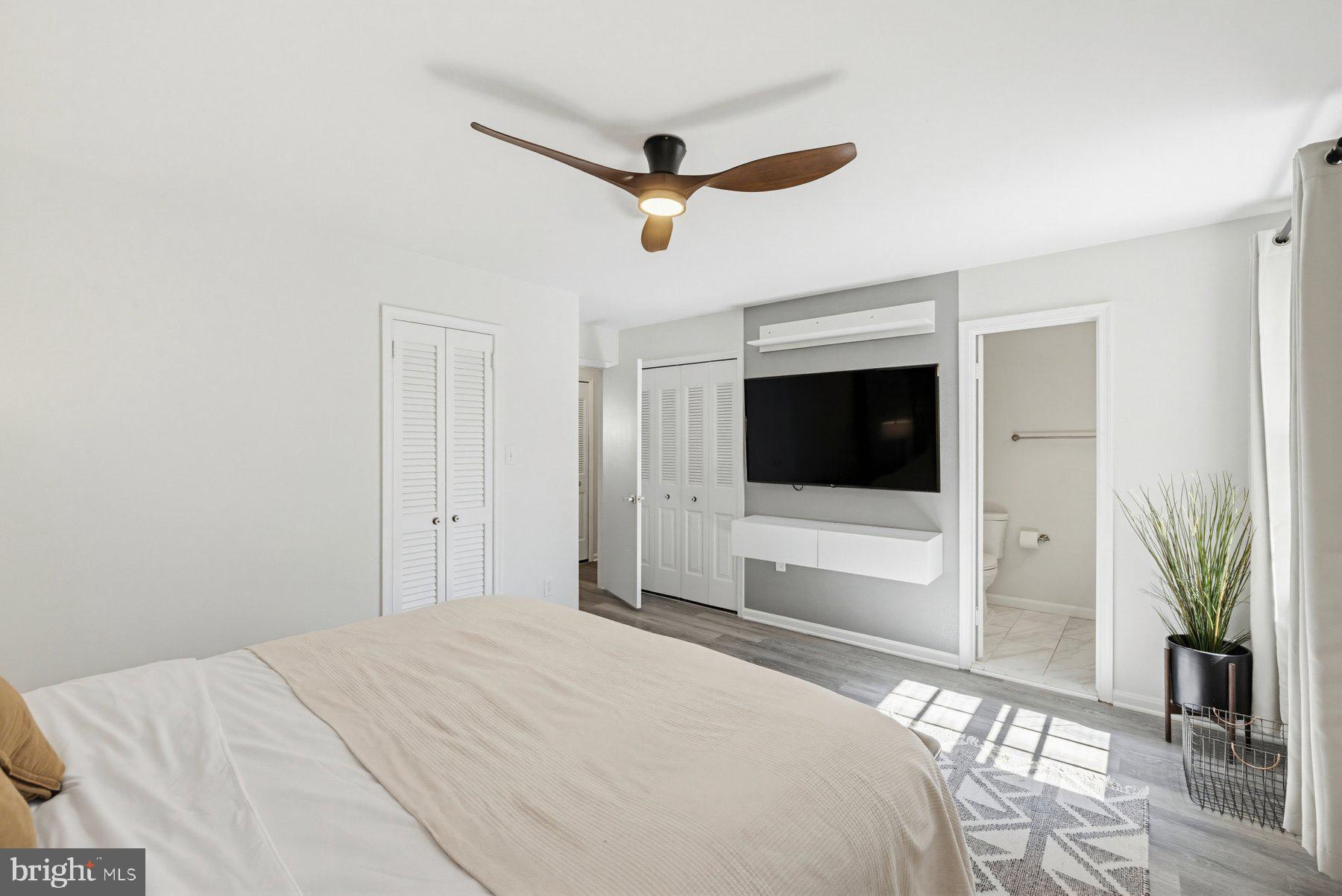 7305 Langsford Court Springfield, VA 22153 - Photo 20 of 46 a bedroom with a bed and a flat screen tv