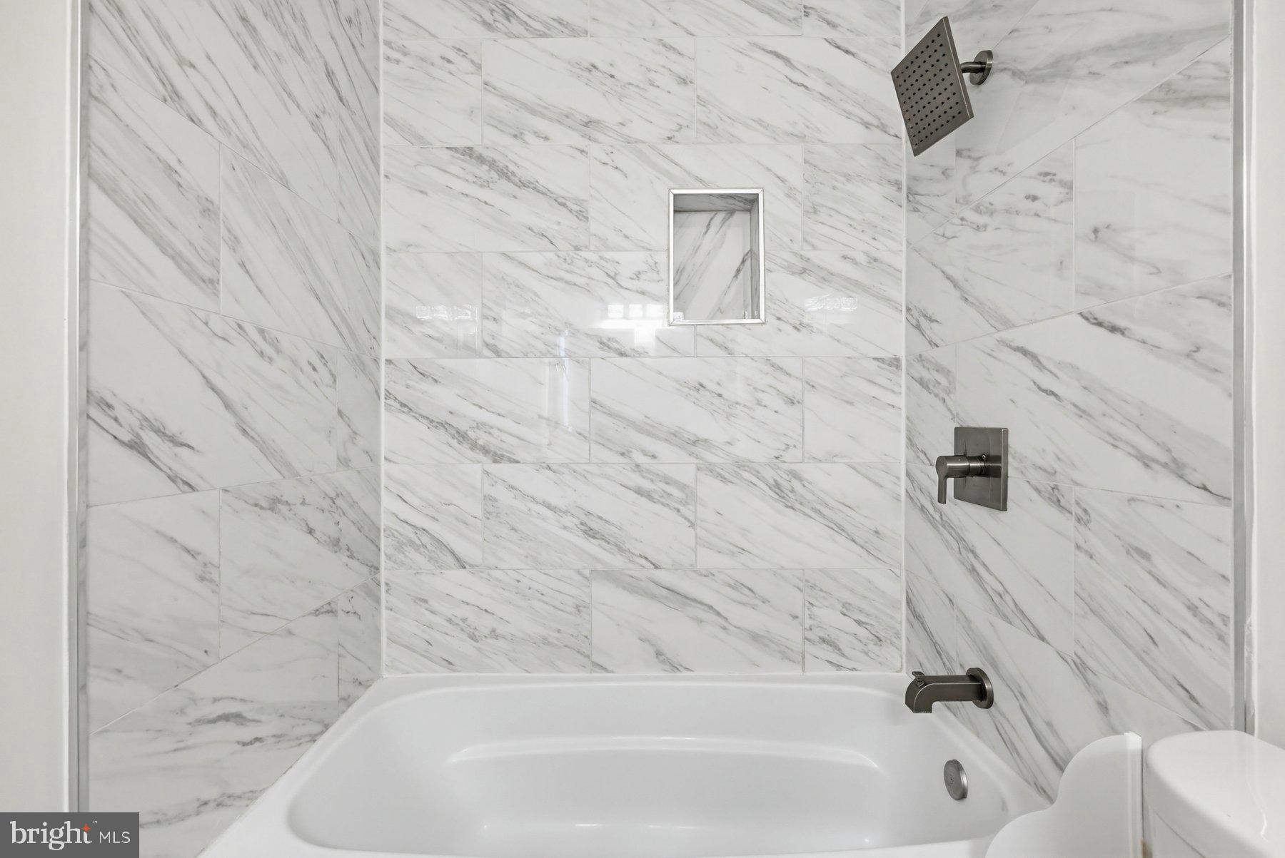 7305 Langsford Court Springfield, VA 22153 - Photo 21 of 46 a bathroom with a bathtub