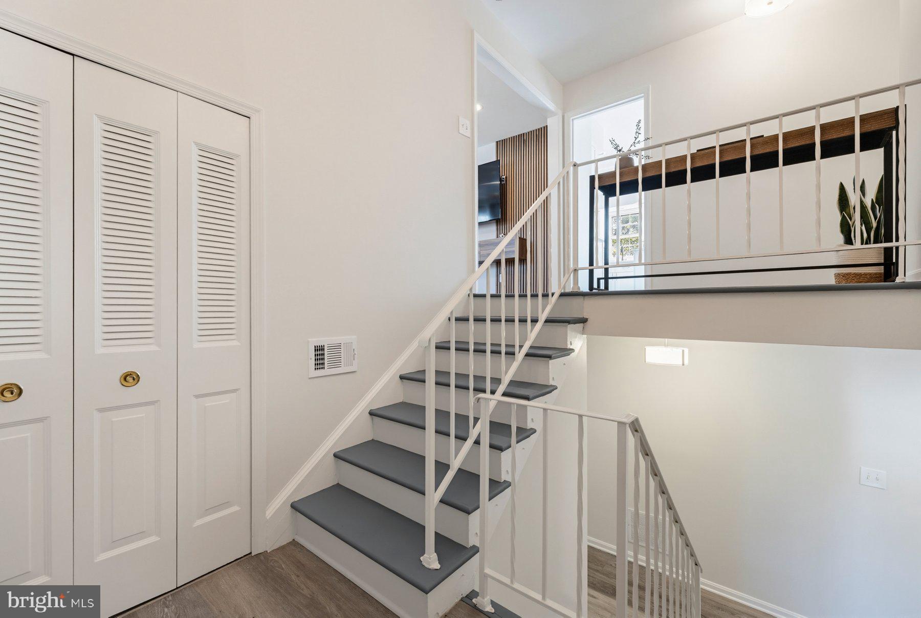7305 Langsford Court Springfield, VA 22153 - Photo 29 of 46 a view of entryway with wooden floor and stairs