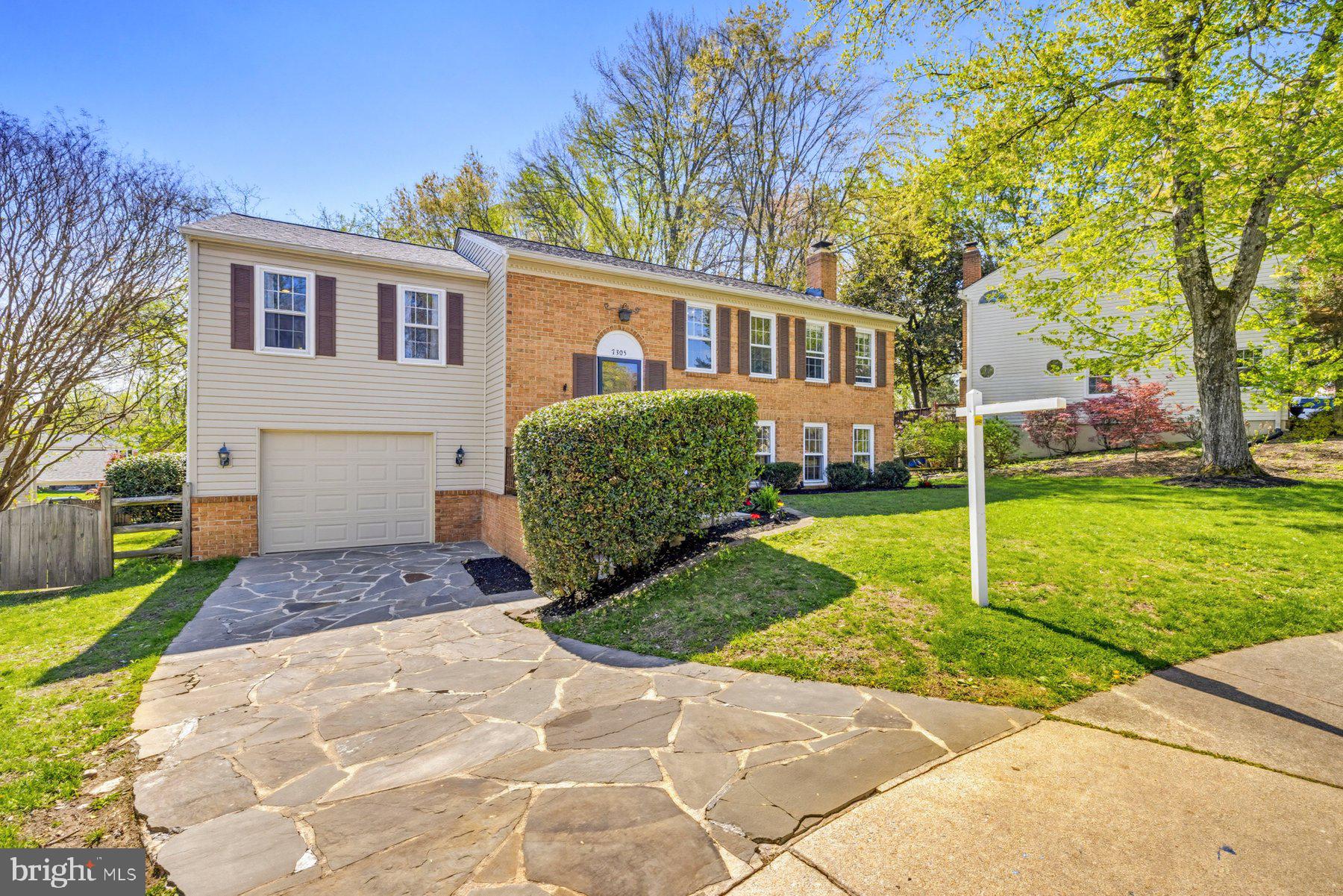 7305 Langsford Court Springfield, VA 22153 - Photo 4 of 46 a view of a house with a yard