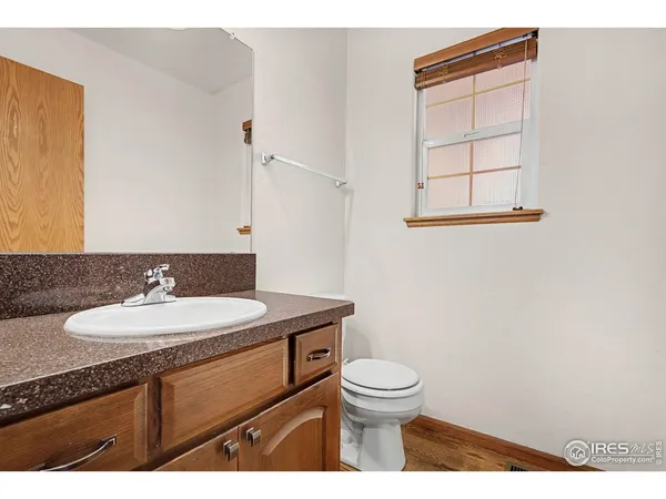 a bathroom with a sink toilet double vanity and shower
