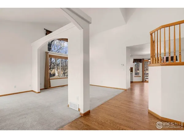 a view interior of a house and an entryway with wooden floor