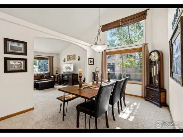a view of empty room with fireplace and fan