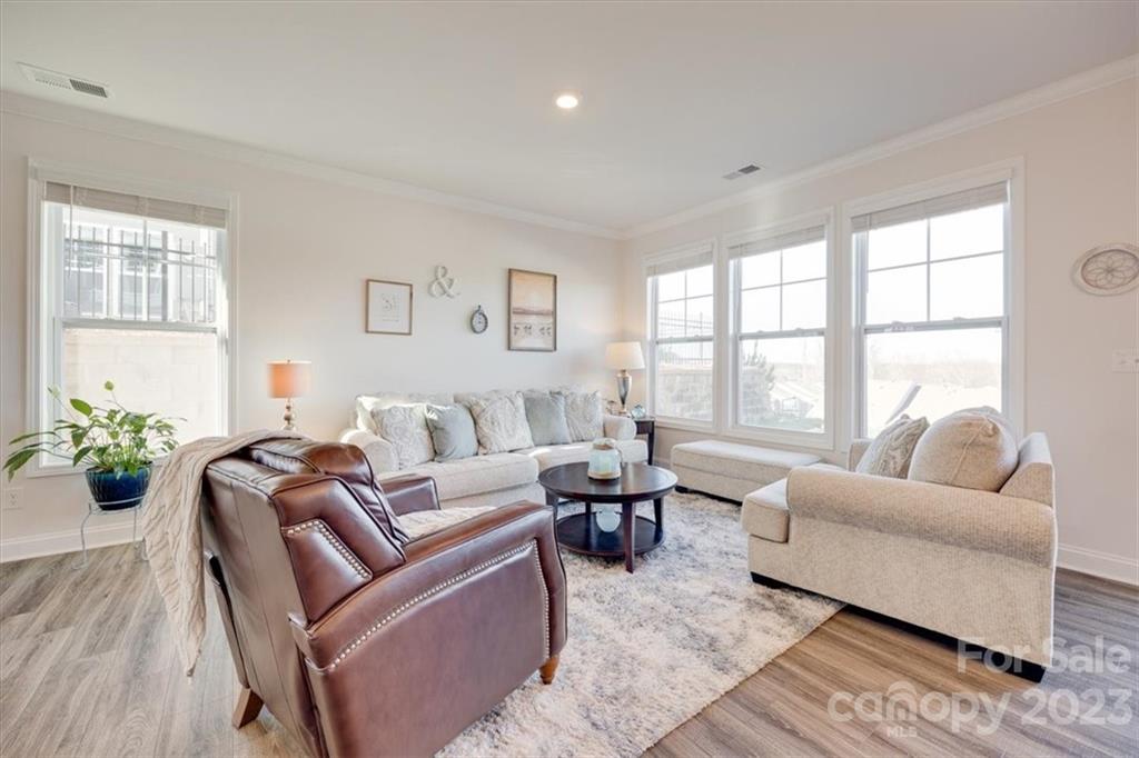 311 Bulrush Rd Lake Lake Wylie, SC 29710 - Photo 11 of 35 a living room with furniture and floor to ceiling windows
