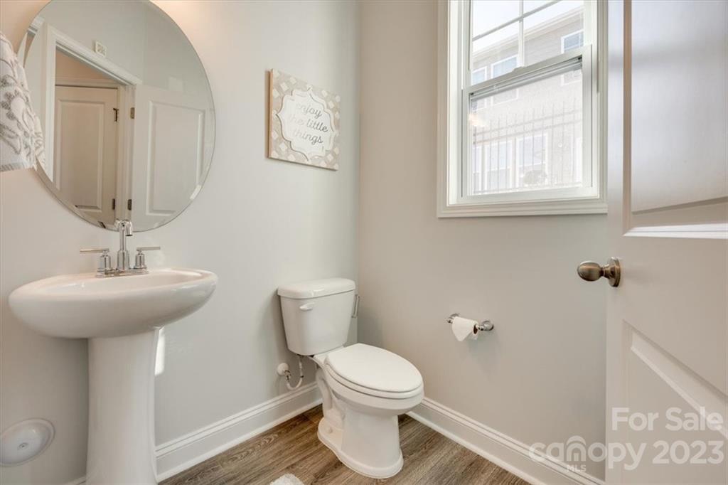 311 Bulrush Rd Lake Lake Wylie, SC 29710 - Photo 14 of 35 a bathroom with a toilet a sink and a window