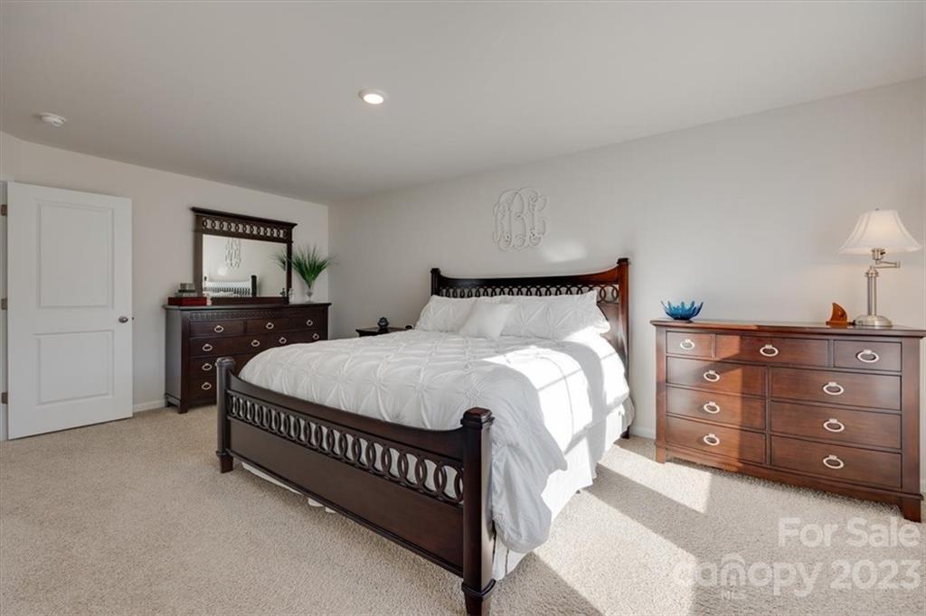 311 Bulrush Rd Lake Lake Wylie, SC 29710 - Photo 19 of 35 a bedroom with a bed and dresser