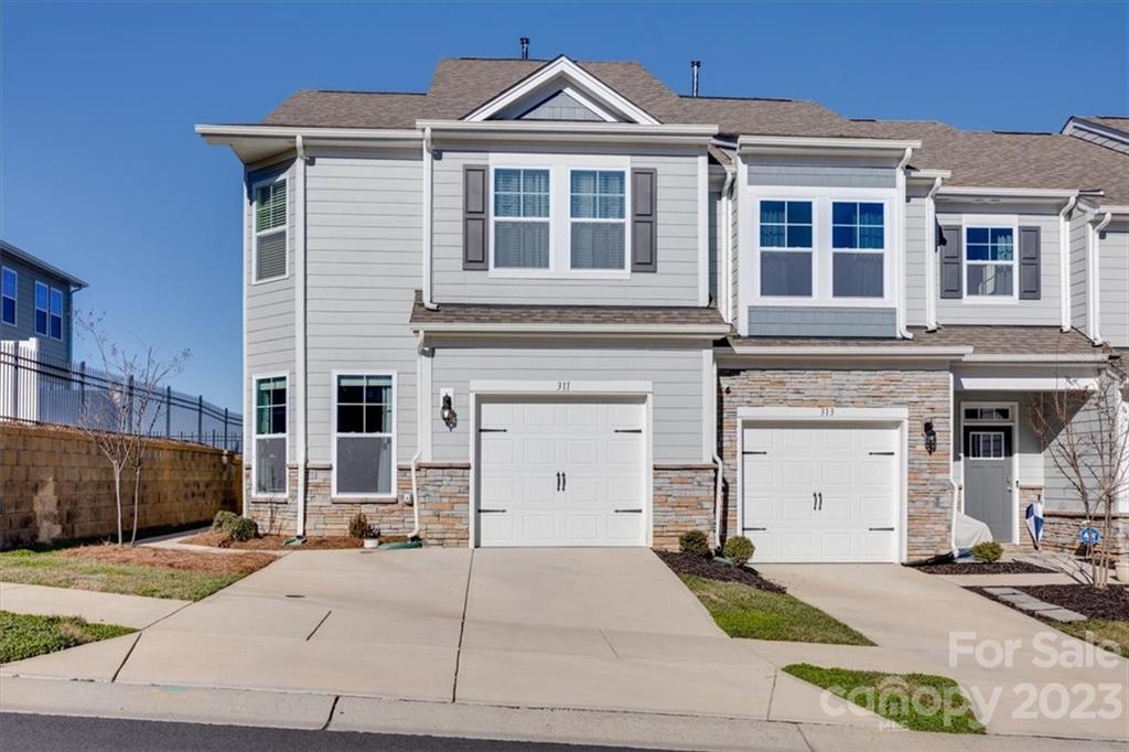 311 Bulrush Rd Lake Lake Wylie, SC 29710 - Photo 2 of 35 a front view of a house with a yard