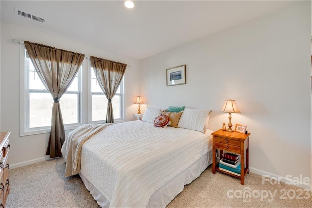 311 Bulrush Rd Lake Lake Wylie, SC 29710 - Photo 23 of 35 a bedroom with a bed and a window
