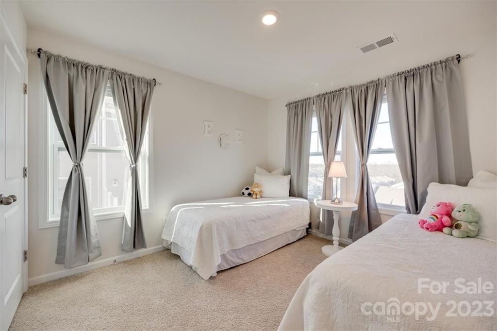 311 Bulrush Rd Lake Lake Wylie, SC 29710 - Photo 24 of 35 a bedroom with two beds and a window