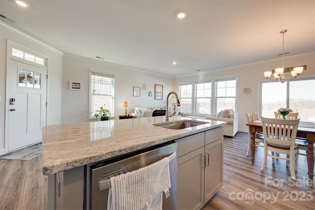 311 Bulrush Rd Lake Lake Wylie, SC 29710 - Photo 6 of 35 a kitchen with center island table and chairs