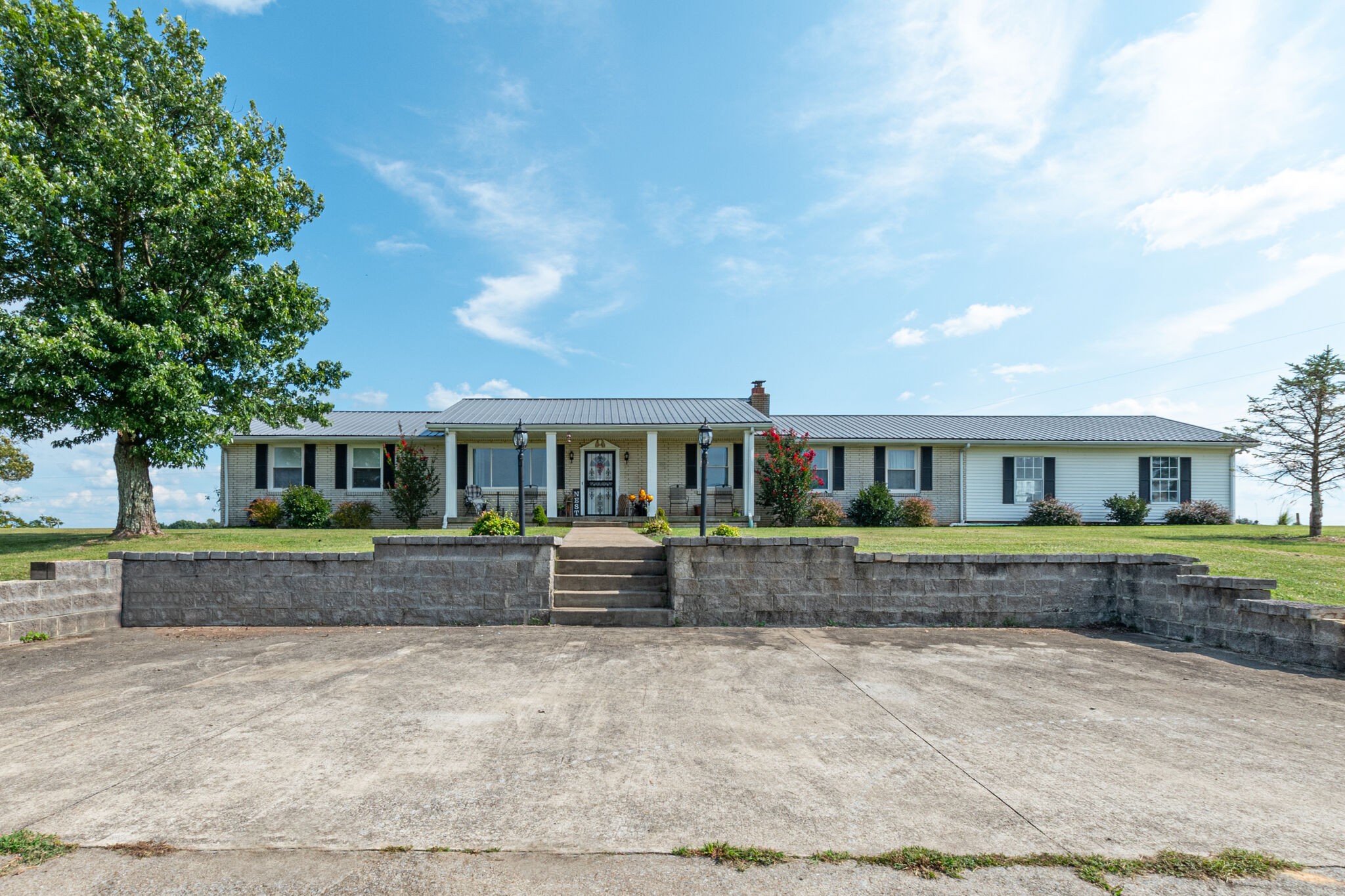 540 Cook Road Portland, TN 37148 - Photo 1 of 32 a front view of a house with a yard