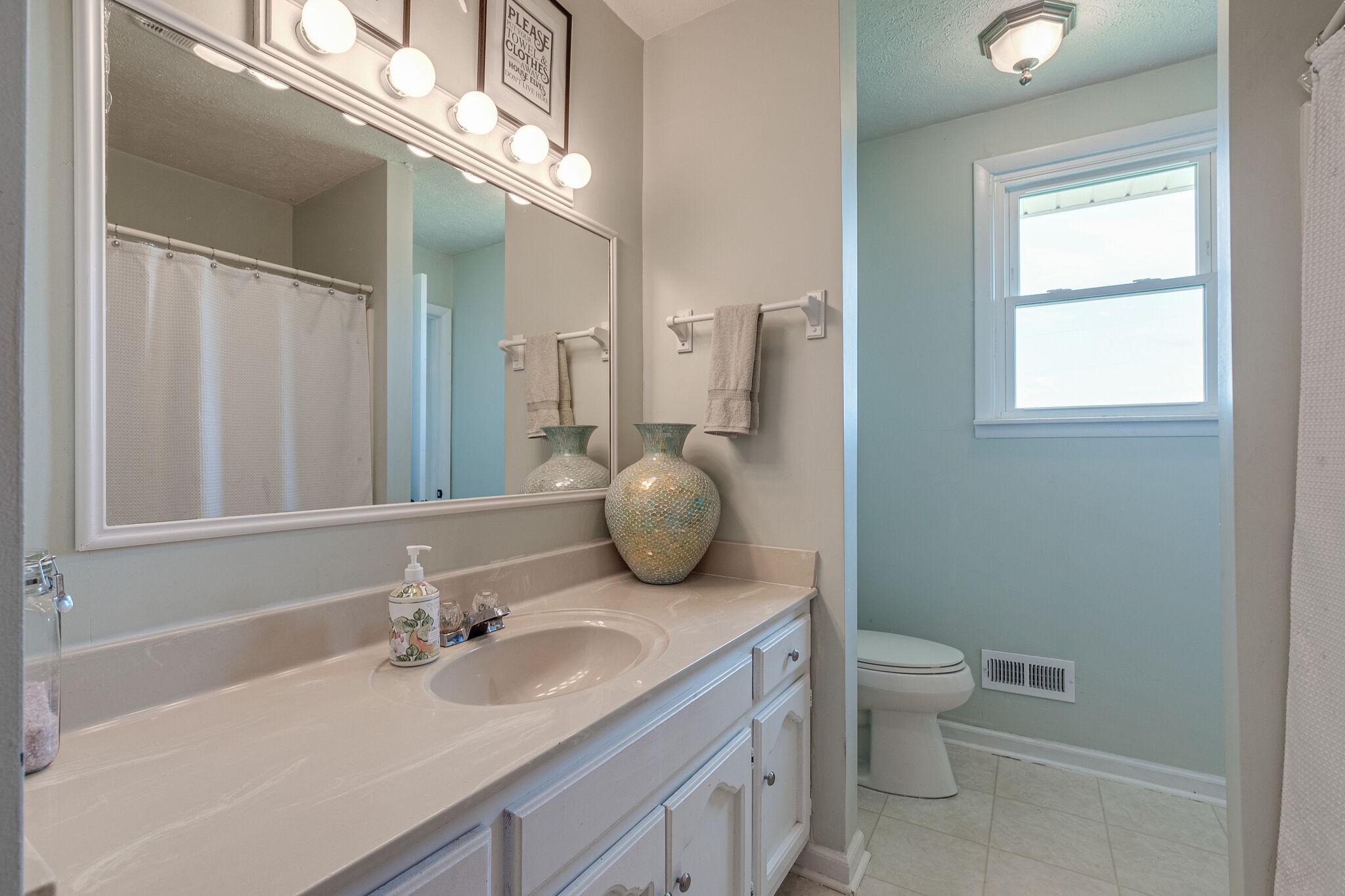 540 Cook Road Portland, TN 37148 - Photo 23 of 32 a bathroom with a granite countertop sink a toilet and mirror