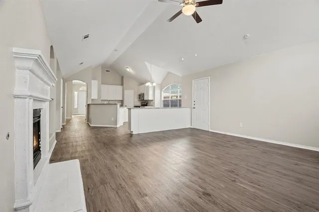 a view of a kitchen with a dishwasher and a refrigerator