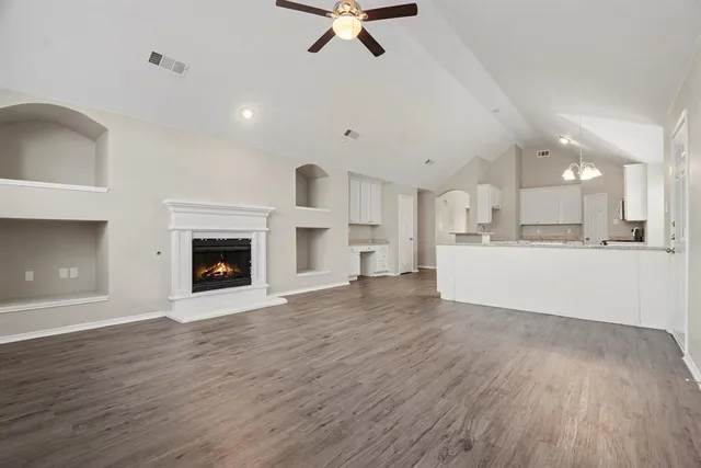 a view of kitchen with sink and wooden floor