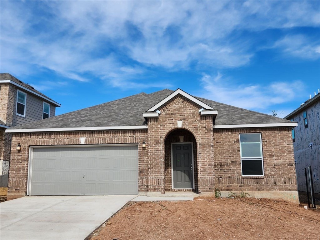 7406 Tuely Trail Austin, TX 78744 - Photo 1 of 1 a front view of a house with yard