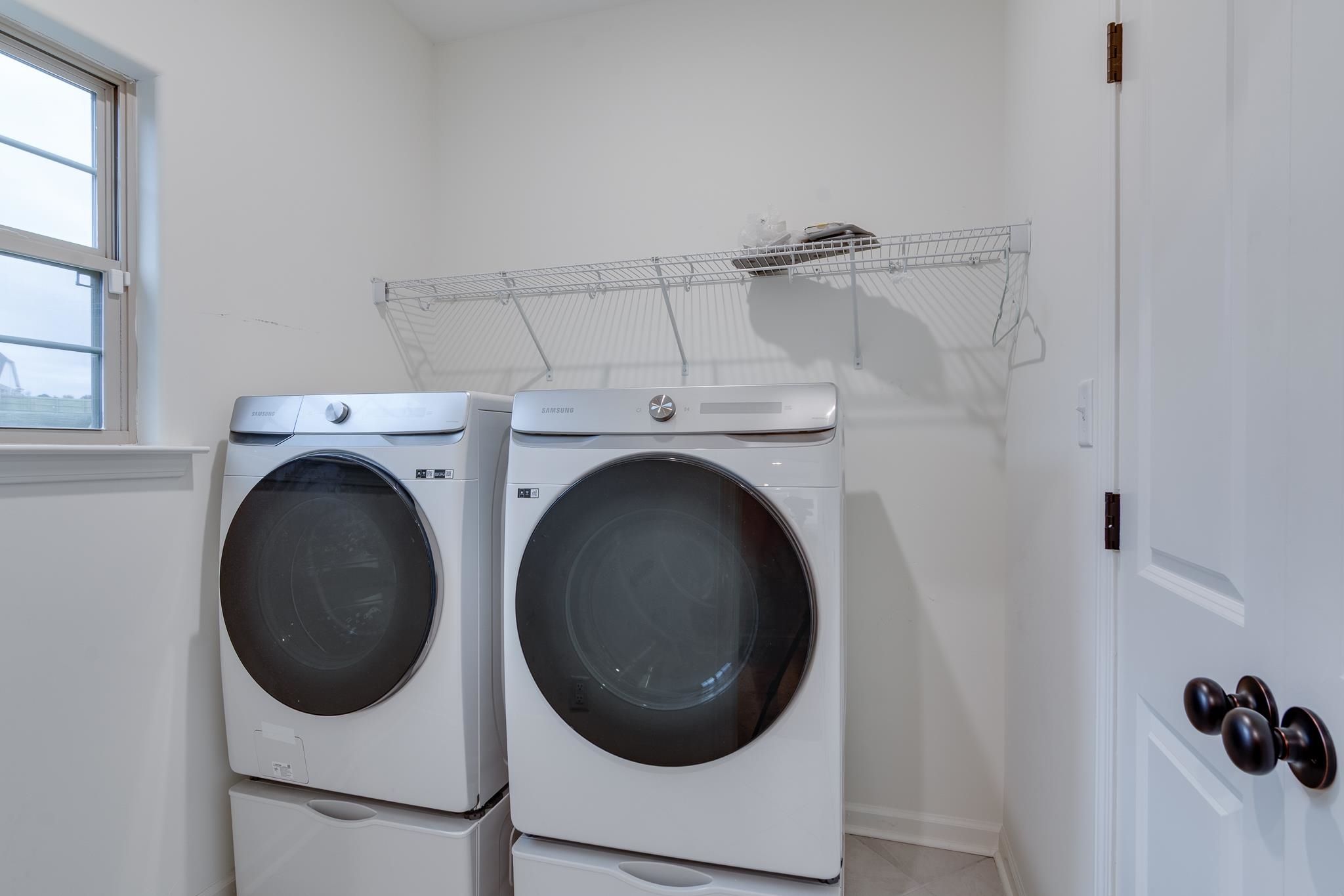 155 Misty Ridge Loop Oakland, TN 38060 - Photo 11 of 26 a utility room with dryer and washer