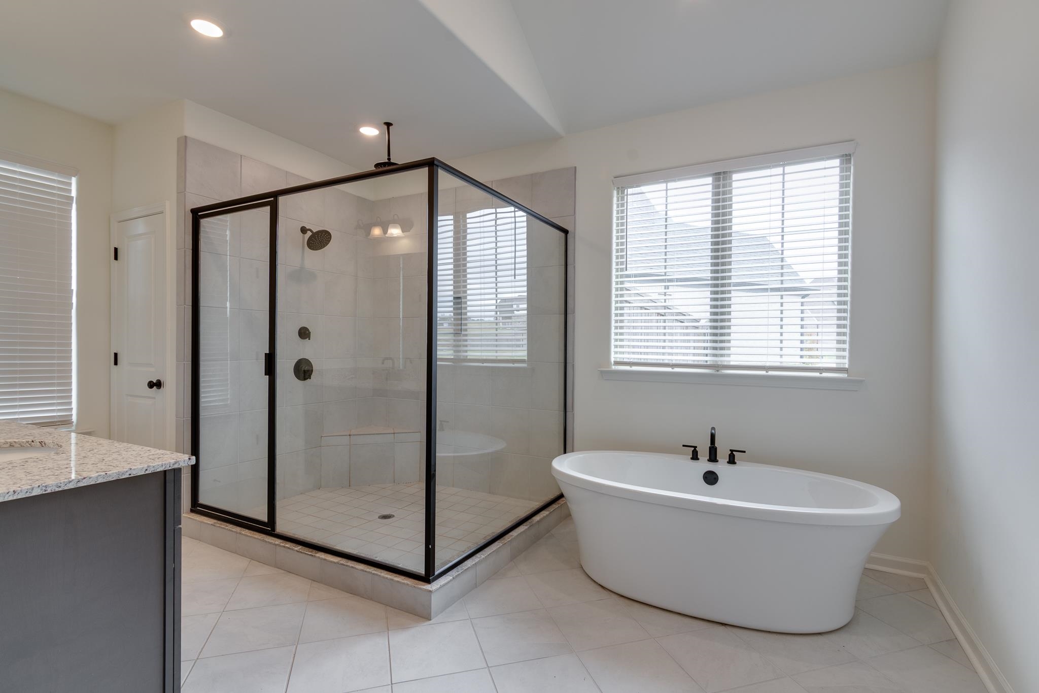 155 Misty Ridge Loop Oakland, TN 38060 - Photo 15 of 26 a bathroom with a bathtub and a shower