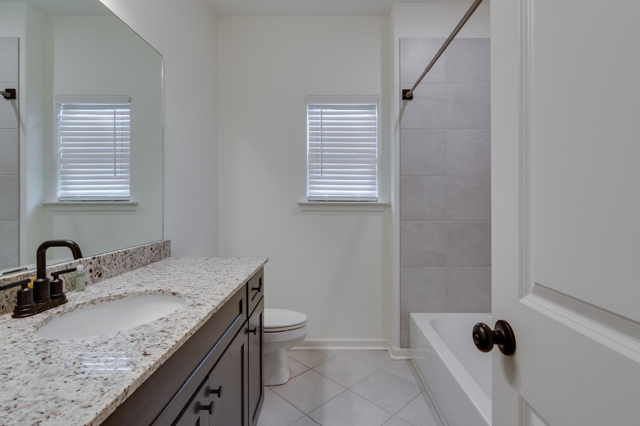 155 Misty Ridge Loop Oakland, TN 38060 - Photo 17 of 26 a bathroom with a granite countertop sink toilet and shower