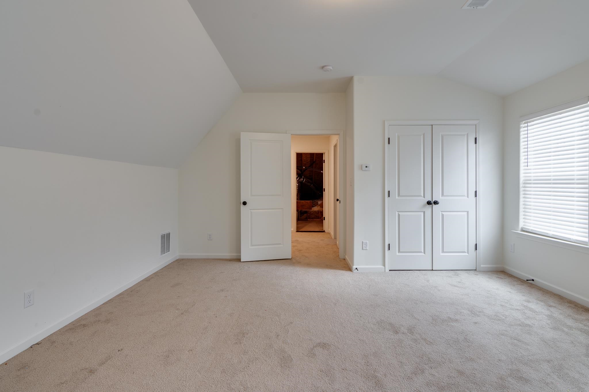155 Misty Ridge Loop Oakland, TN 38060 - Photo 21 of 26 an empty room with windows and closet