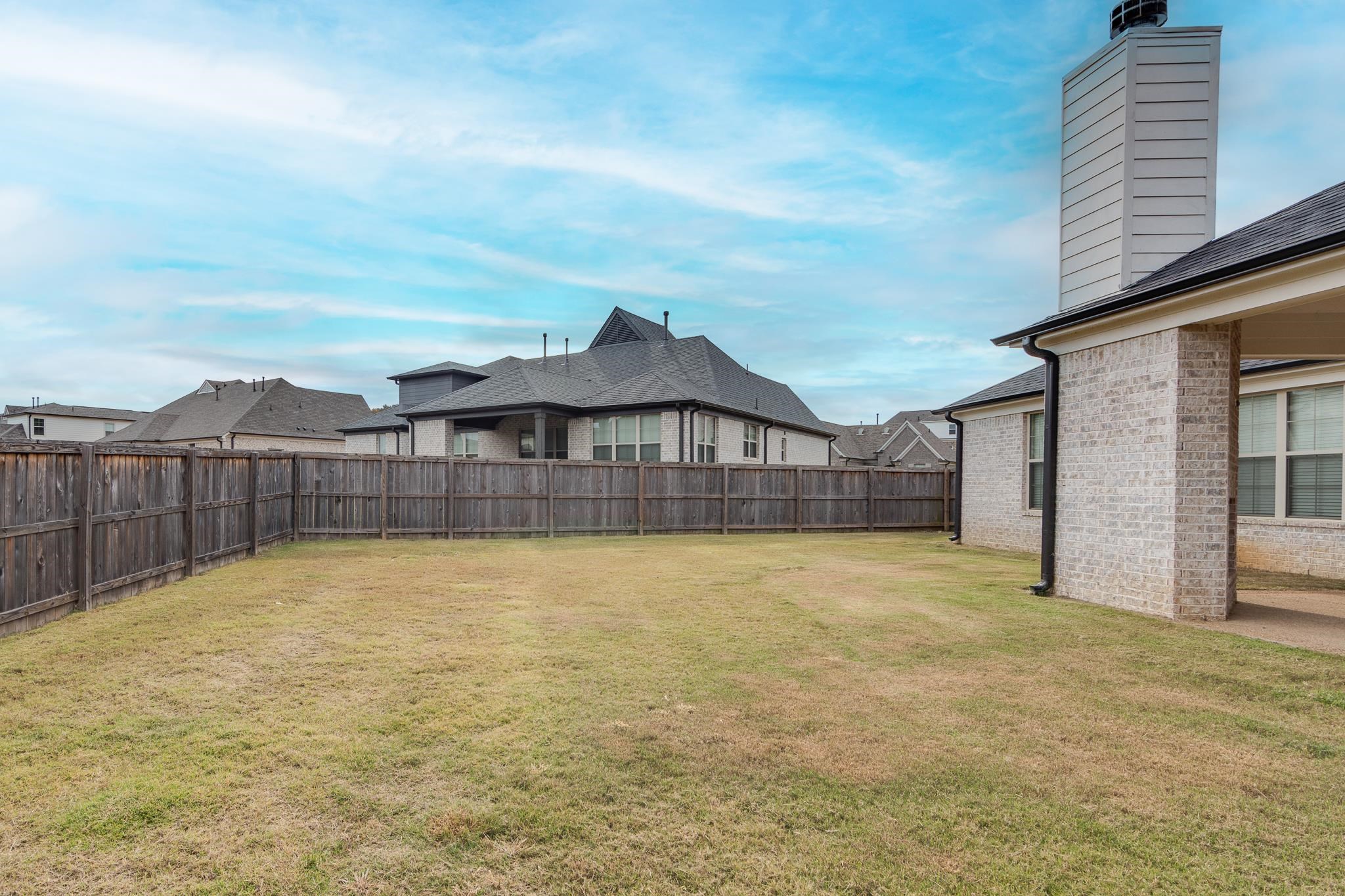 155 Misty Ridge Loop Oakland, TN 38060 - Photo 26 of 26 a view of a house with a swimming pool and wooden fence