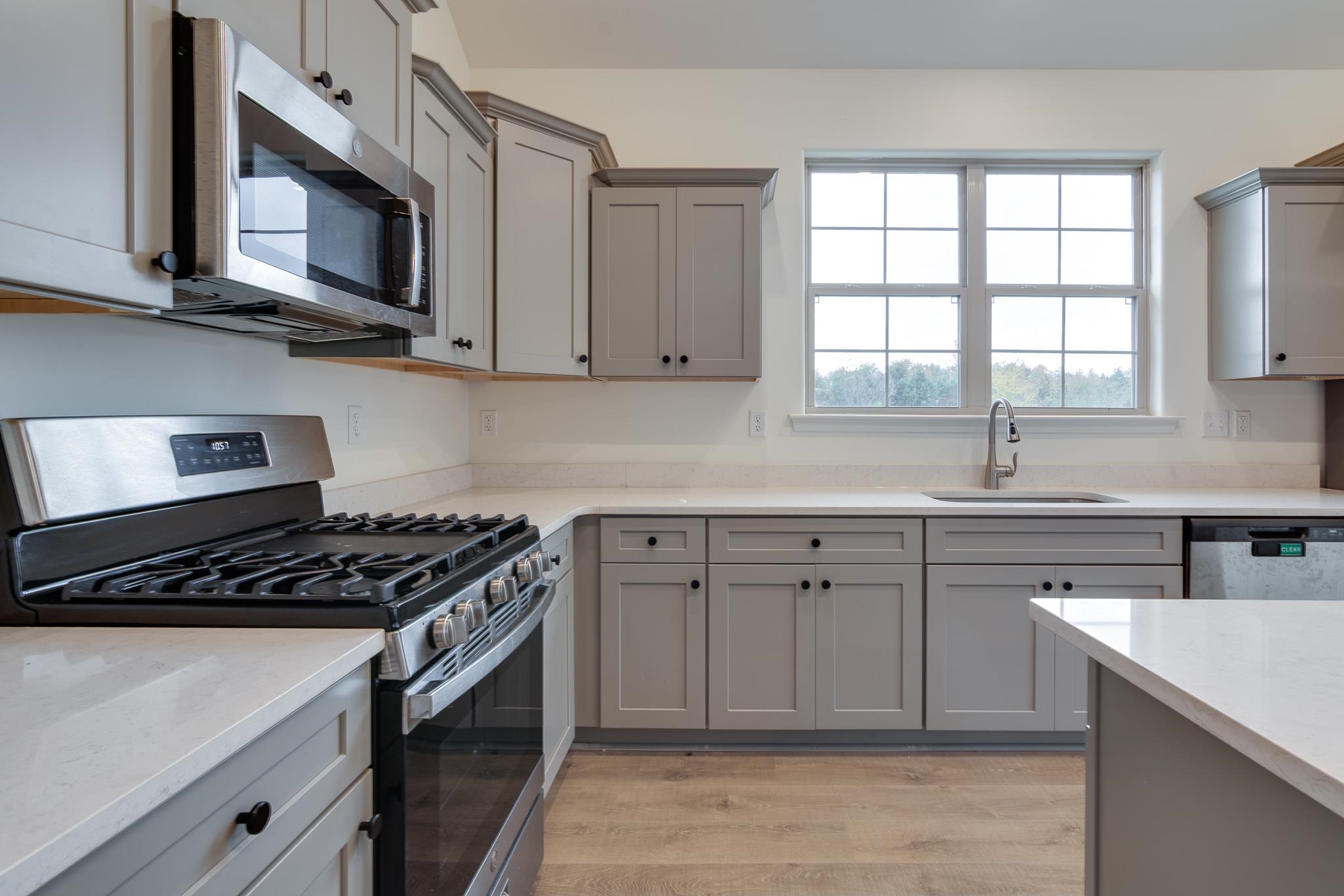 155 Misty Ridge Loop Oakland, TN 38060 - Photo 7 of 26 a kitchen with cabinets appliances a sink and a window
