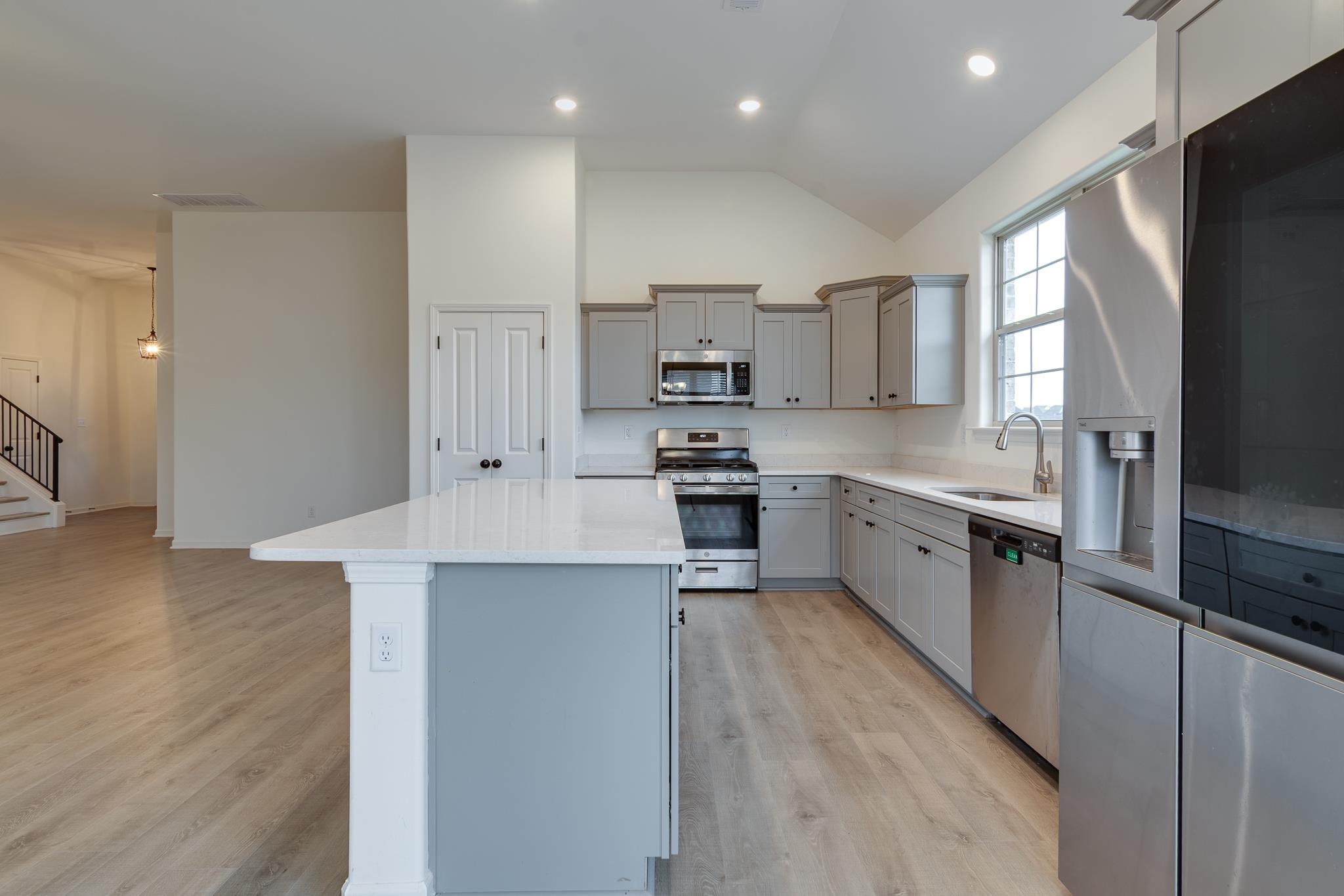 155 Misty Ridge Loop Oakland, TN 38060 - Photo 9 of 26 a large kitchen with stainless steel appliances lots of counter space and a sink
