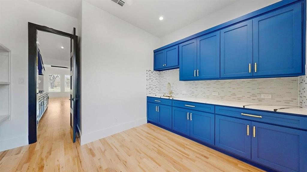 1860 Old Telico Road Ennis, TX 75119 - Photo 11 of 40 a kitchen with stainless steel appliances granite countertop wooden cabinets and a refrigerator
