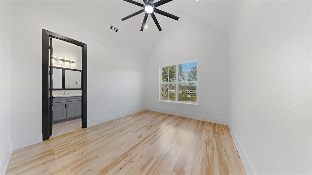 1860 Old Telico Road Ennis, TX 75119 - Photo 17 of 40 wooden floor in an empty room with a window
