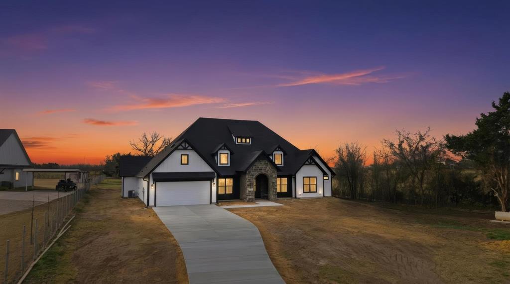 1860 Old Telico Road Ennis, TX 75119 - Photo 3 of 40 a front view of a house with a yard