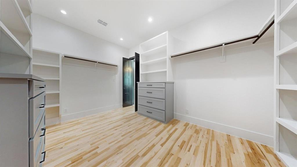 1860 Old Telico Road Ennis, TX 75119 - Photo 31 of 40 a view of empty room with wooden floor and cabinet