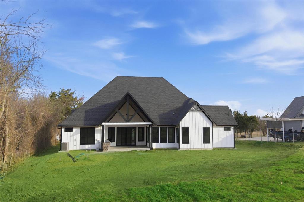 1860 Old Telico Road Ennis, TX 75119 - Photo 32 of 40 a front view of a house with a garden