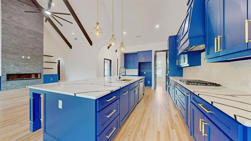 1860 Old Telico Road Ennis, TX 75119 - Photo 7 of 40 a kitchen with stainless steel appliances granite countertop a stove a sink dishwasher and a refrigerator