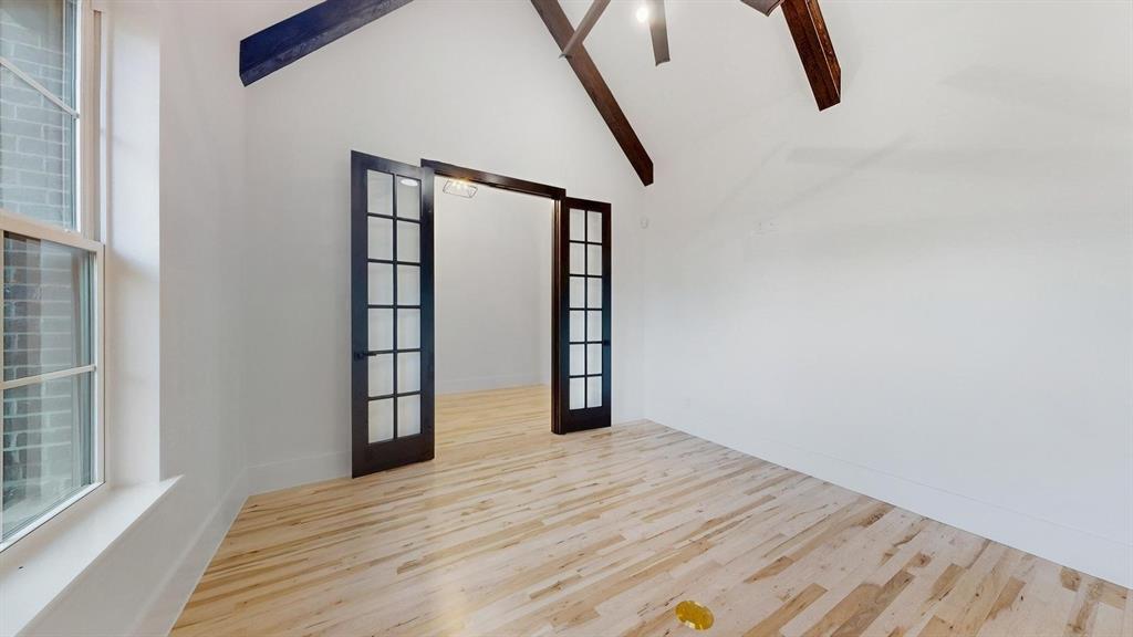 1860 Old Telico Road Ennis, TX 75119 - Photo 10 of 40 a view of empty room with wooden floor and fan