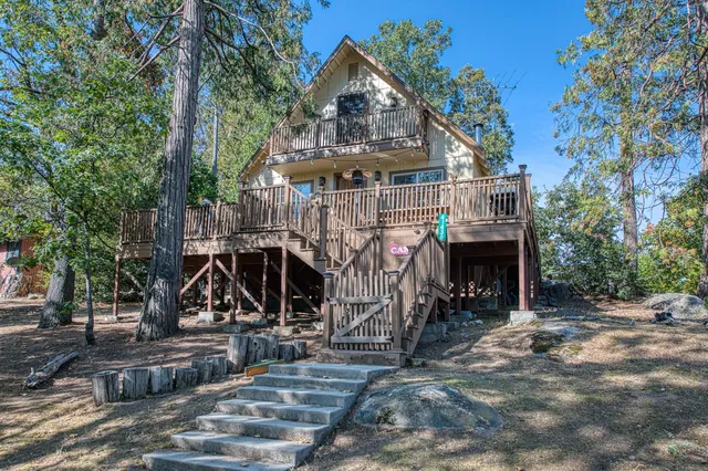 a view of house with outdoor space and seating