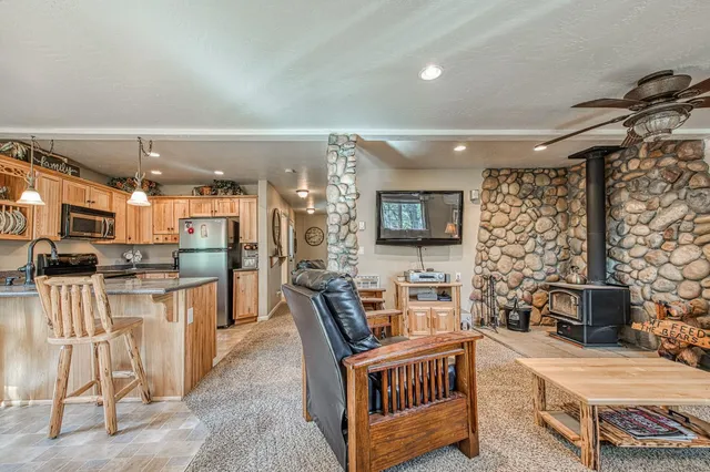 a dining room with furniture and a kitchen view