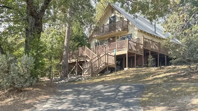 a view of a house with a tree