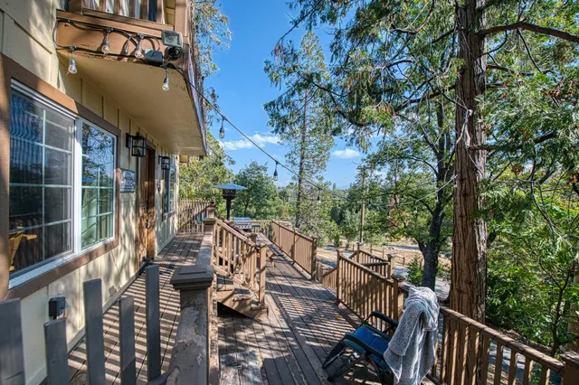 a view of a house with wooden fence