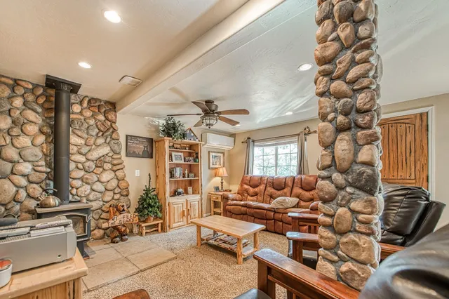 a living room with lots of furniture and a chandelier