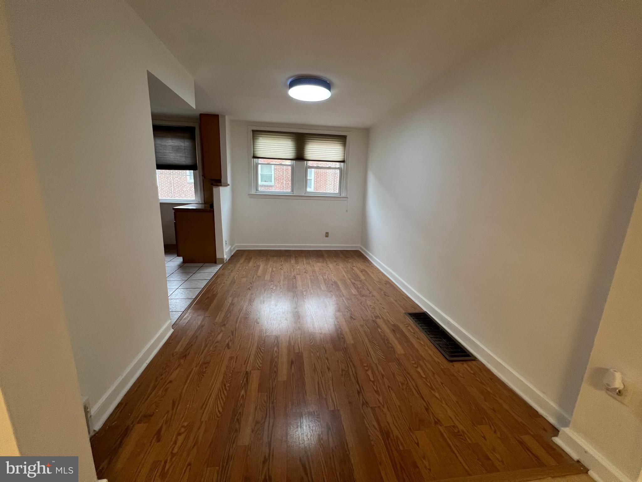 4312 Loring Street Philadelphia, PA 19136 - Photo 3 of 14 wooden floor in an empty room with a window