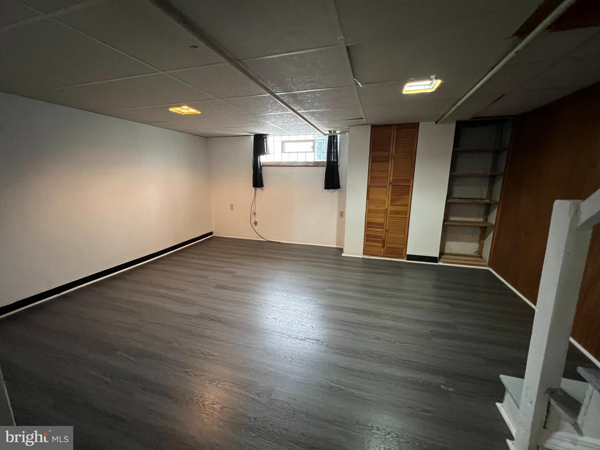 4312 Loring Street Philadelphia, PA 19136 - Photo 6 of 14 an empty room with wooden floor and windows