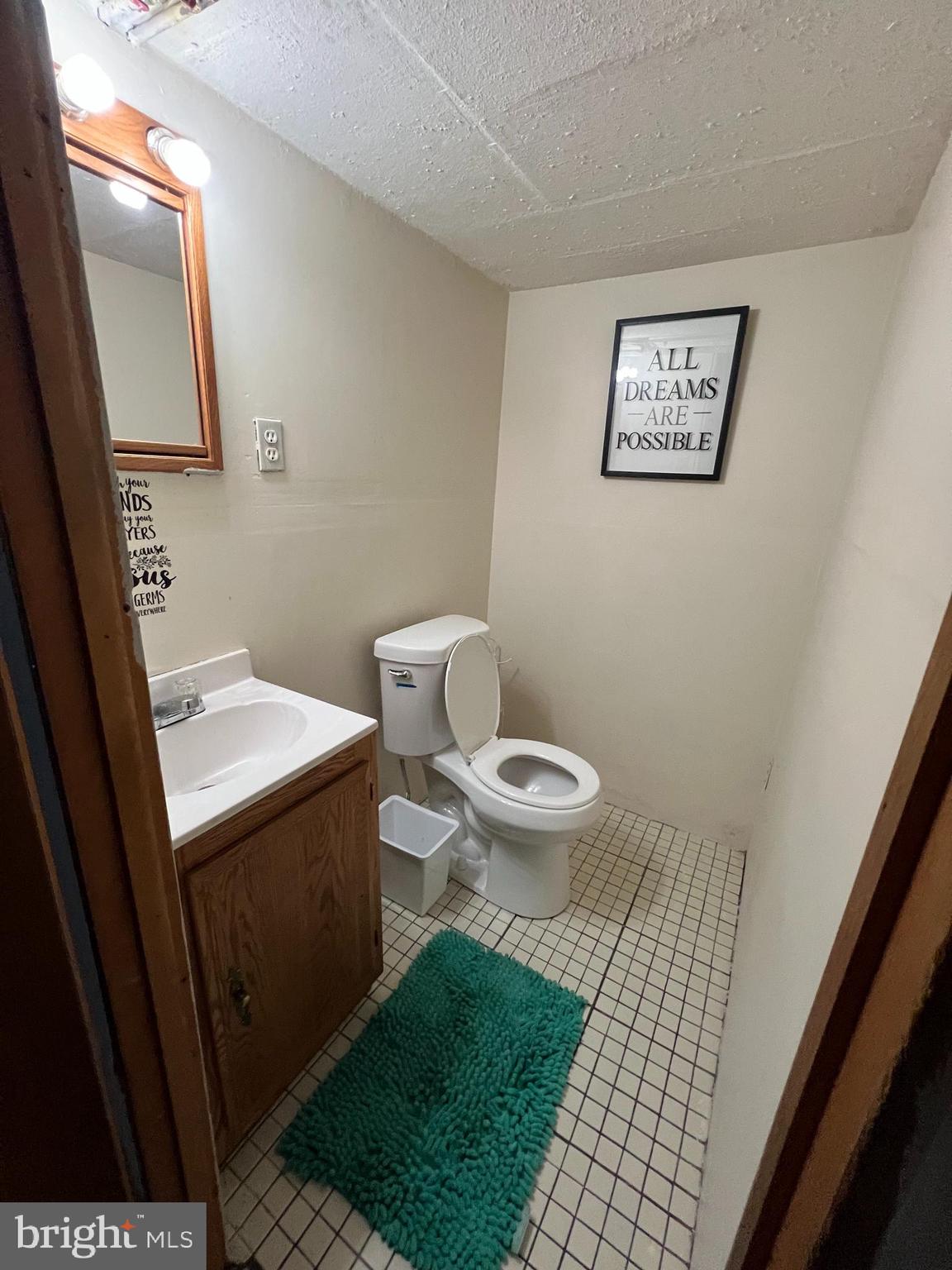 4312 Loring Street Philadelphia, PA 19136 - Photo 7 of 14 a bathroom with a toilet and a mirror