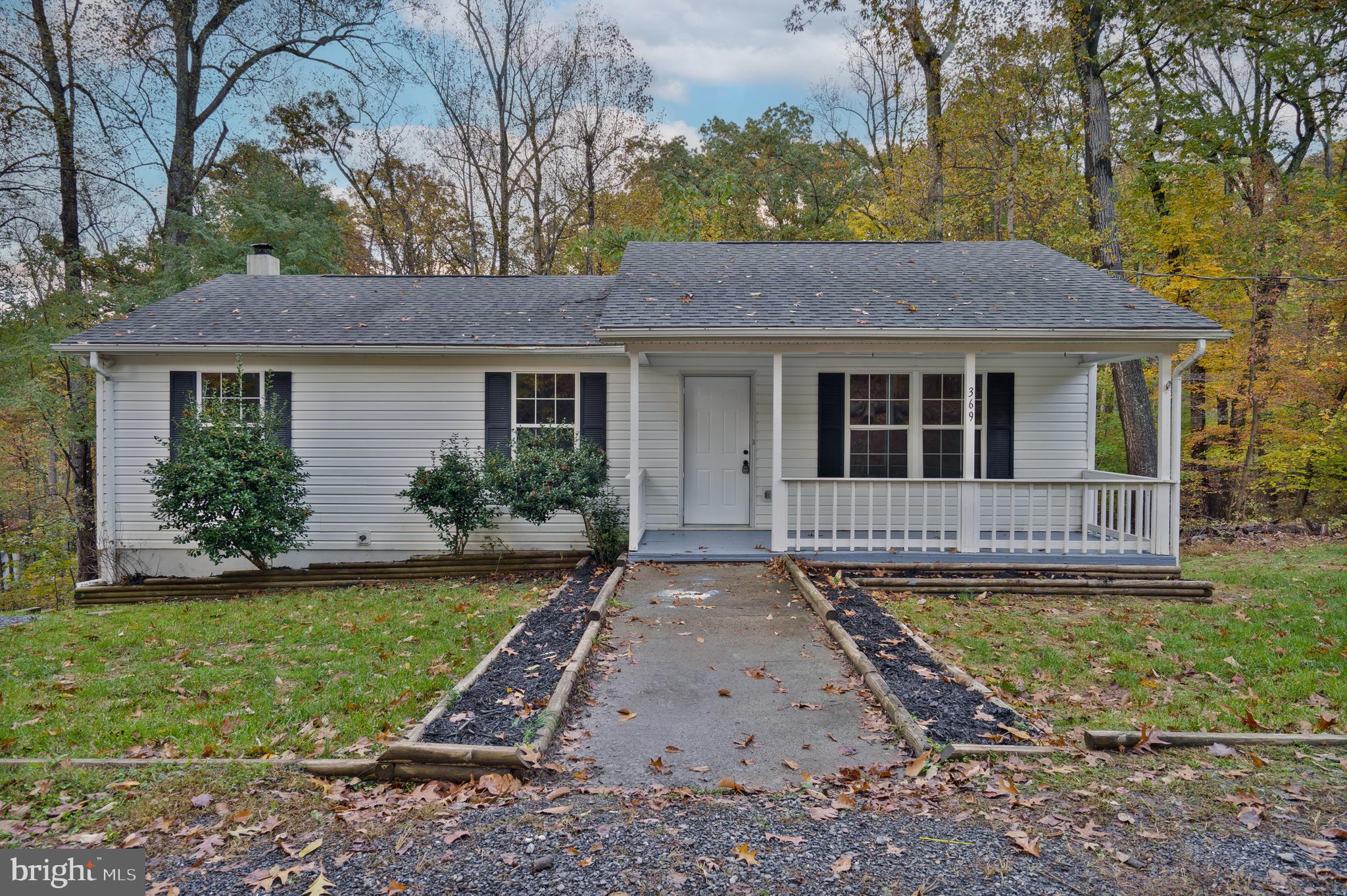 369 Wild Hare Road Harpers Ferry, WV 25425 - Photo 1 of 29 a view of a house with a yard