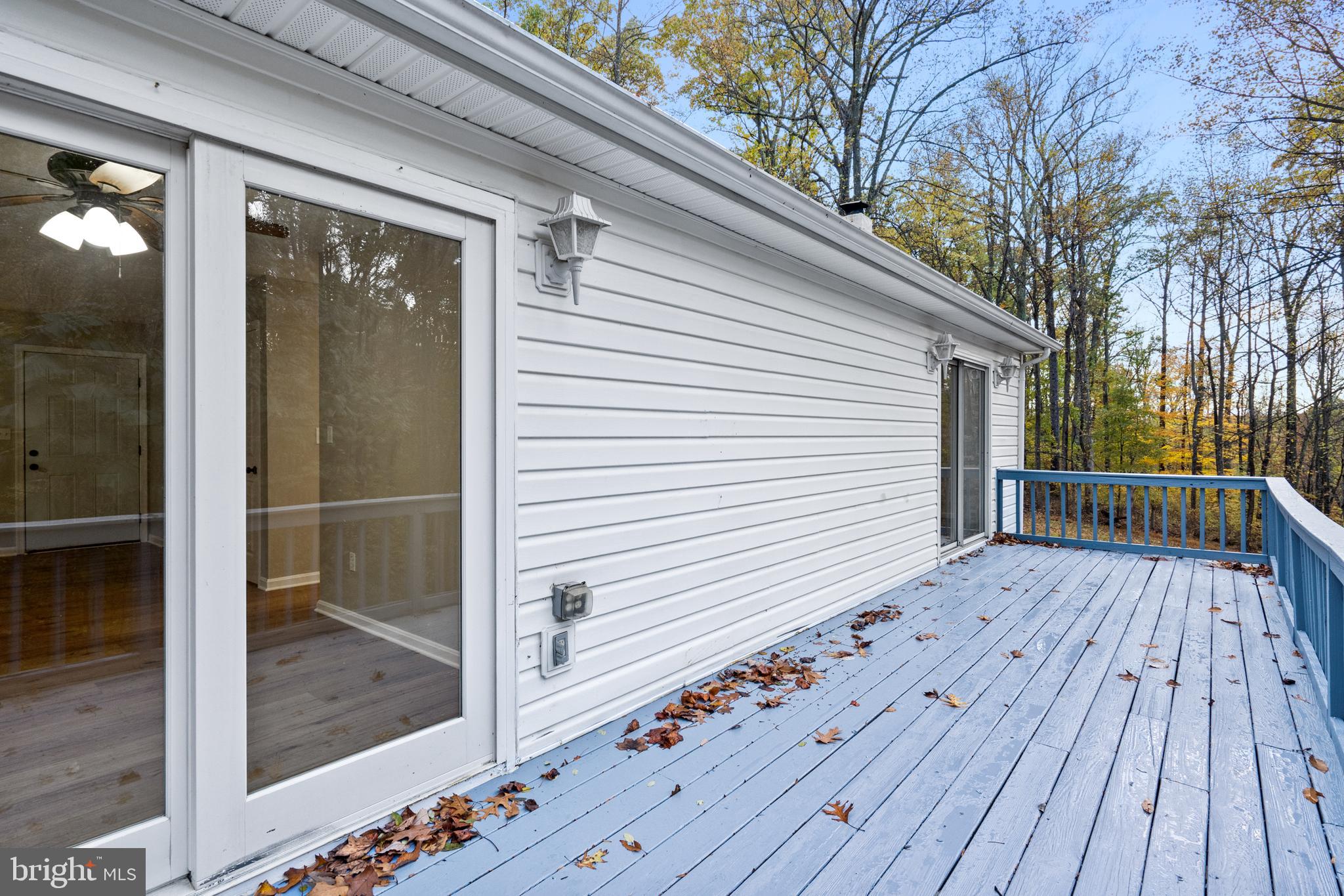 369 Wild Hare Road Harpers Ferry, WV 25425 - Photo 14 of 29 a view of a balcony with wooden floor and fence