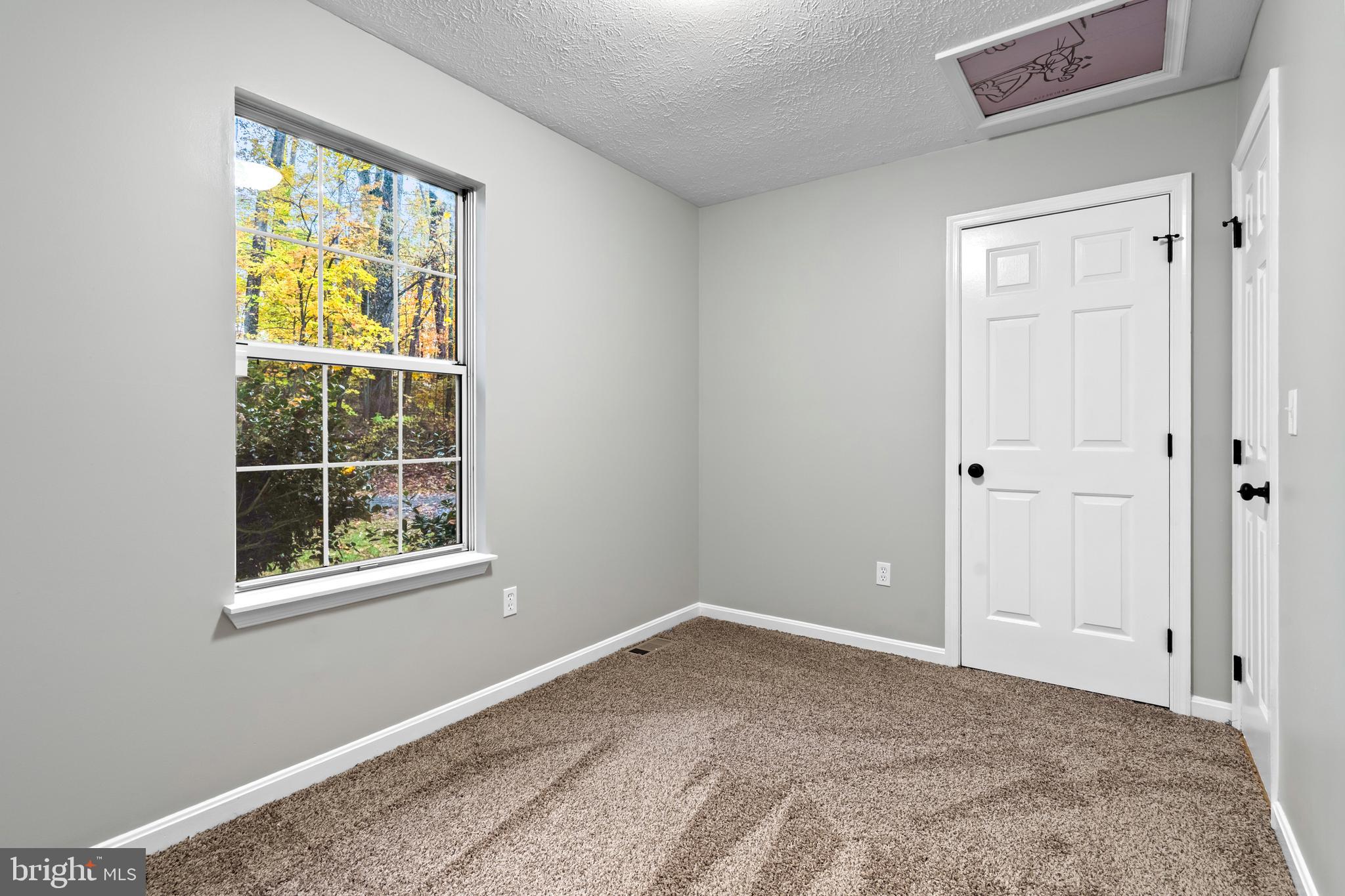 369 Wild Hare Road Harpers Ferry, WV 25425 - Photo 22 of 29 a view of an empty room with a window